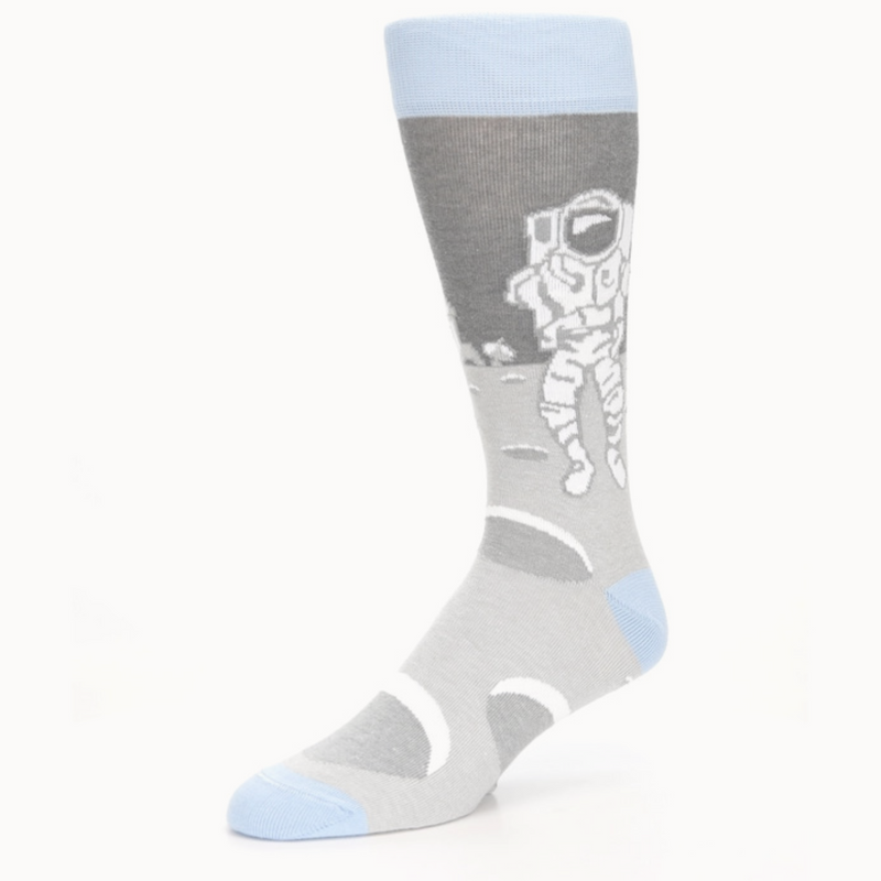 boldSOCKS Moon Astronaut Sock Left side shows Astronaut in Bright White Walking on Moonscape.
