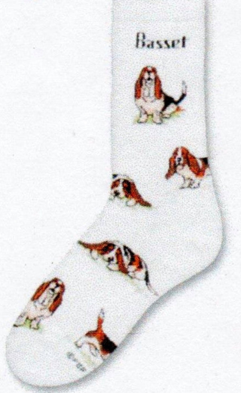 For Bare Feet Basset Poses 2 starts on a White background with the Word Basset under the Cuff. Basset dogs are all over in brown black and white.