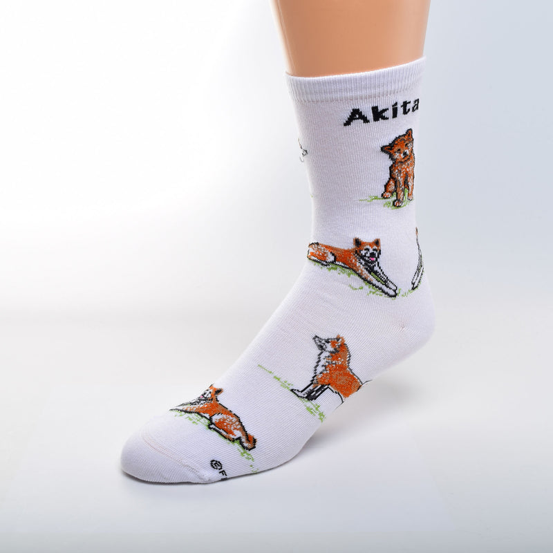 For Bare Feet Akita Poses begin on White.  Akita is in bold Black under the cuff. The Akita is Mahogany, and White, and Black. The Tongue is Rose. All Poses are on a bed of Green Grass.
