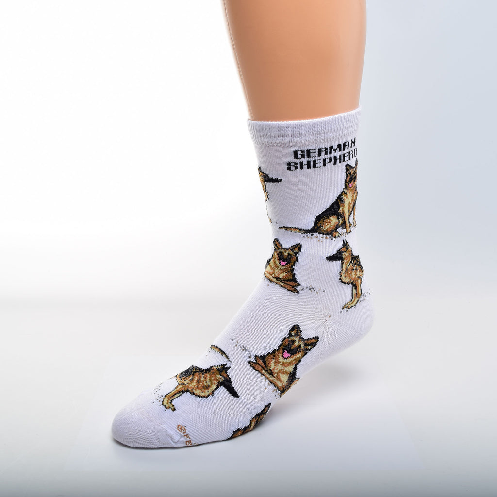 For Bare Feet German Shepherd Poses start on a White background with "German Shepherd" in Bold Black Print on top under the Cuff. Then Poses are Sitting and Standing. The next row gives the third Pose of Laying Down. The German Shepherd is Black, Brown and Tan in color.