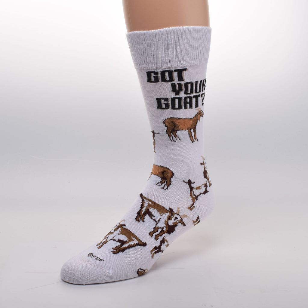 For Bare Feet Got Your Goat Sock starts on a Bright White background. In Bold Black print reads, "Got Your Goat?". There are Goats and Kids all over the Sock. Colors are Browns, Rust, Russet, Camel and more with White and Black.