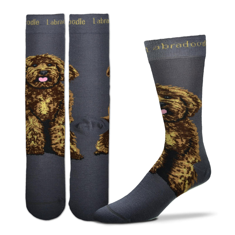 For Bare Feet Realistic Labradoodle Sock starts on a Charcoal background. Labradoodle is in Buff color in the  Cuff spelled out. The Labradoodle Dog is sitting below the Heel and above the Heel going up your ankle towards your knee. He is all fluffy in fur. He is happy with a Pink Tongue and bright eyes looking out at you.