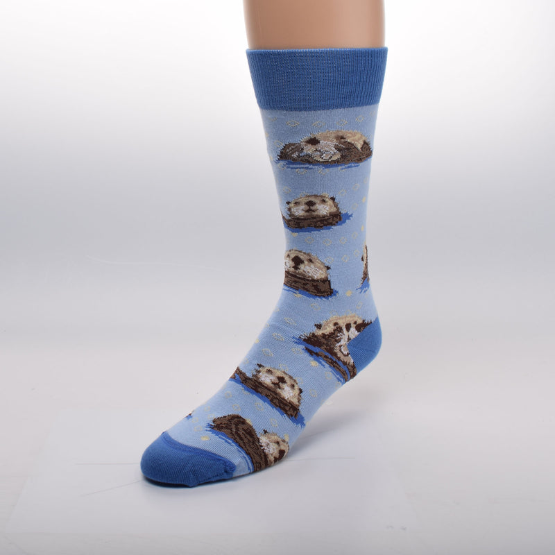 For Bare Feet Sea Otter Poses Sock starts on a Light Blue background with Cerulean Cuffs, Heels and Toes. The Sea Otter Poses are Bobbing Laying Flat and Washing the Face. Colors are the Face, Camel and Buff with Seal Brown for features. The body is Seal Brown and Sepia.