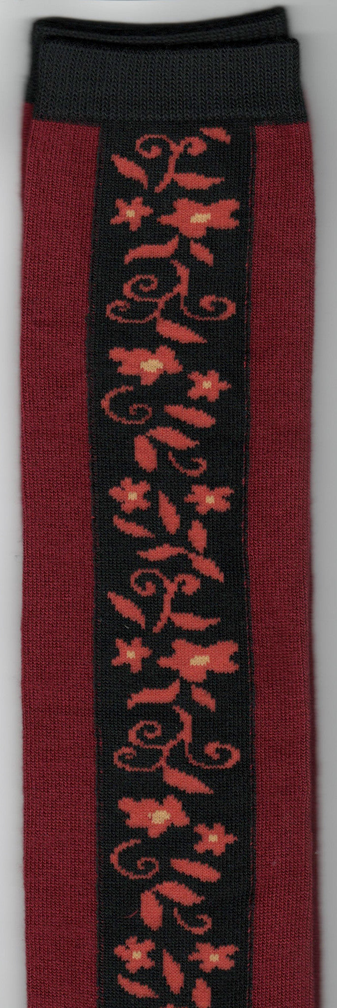 Biking Red has a Black Panel with Flowers, Leaves and Vines in Burnt Orange and Mustard.