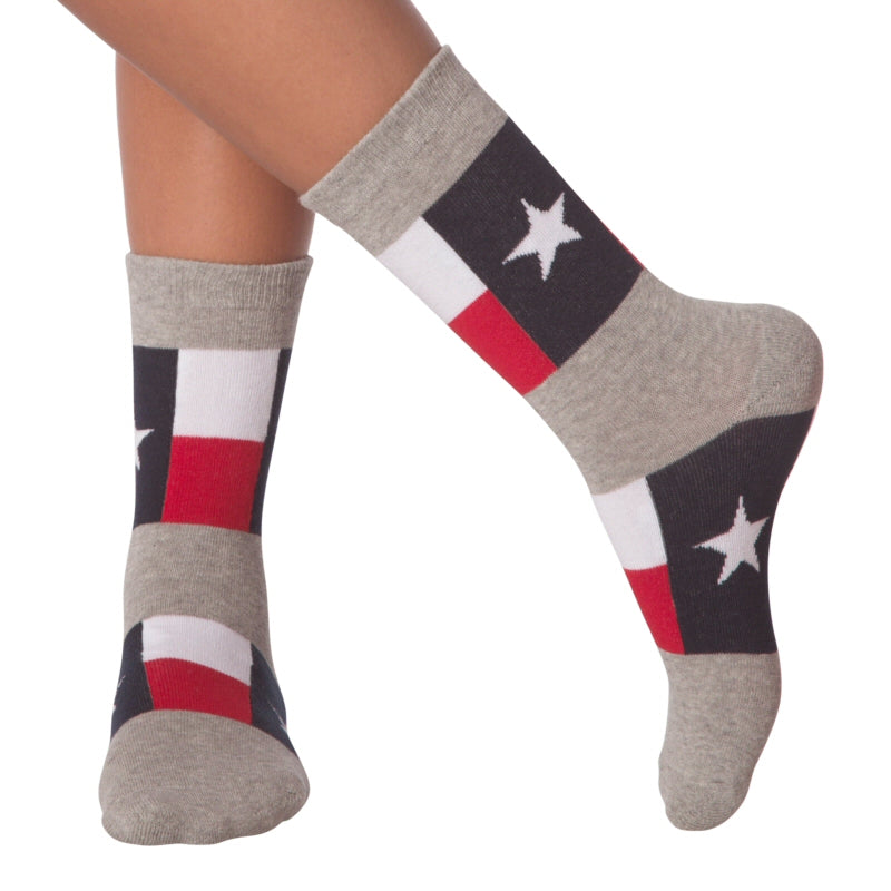 Texas Flag Sock made by K Bell on Model. Background Grey, Lonestar Flag is Blue with 5 Point White Star in the Middle of the field. White and Red Horizontal bars run across the side. The pattern is at the Top and over the Arch.