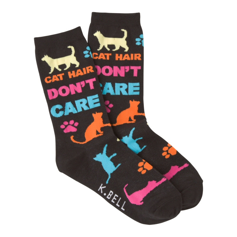 K Bell Cat Hair Don't Care Sock starts on a Black background. Then goes Wild and Crazy with Bright Colors all around. These Colors are Yellow, Cyan, Orange, and Fuchsia. Cats are in Standing, Walking, Laying Down, and Stretching to Scratch! Then there are paw prints scattered all over.