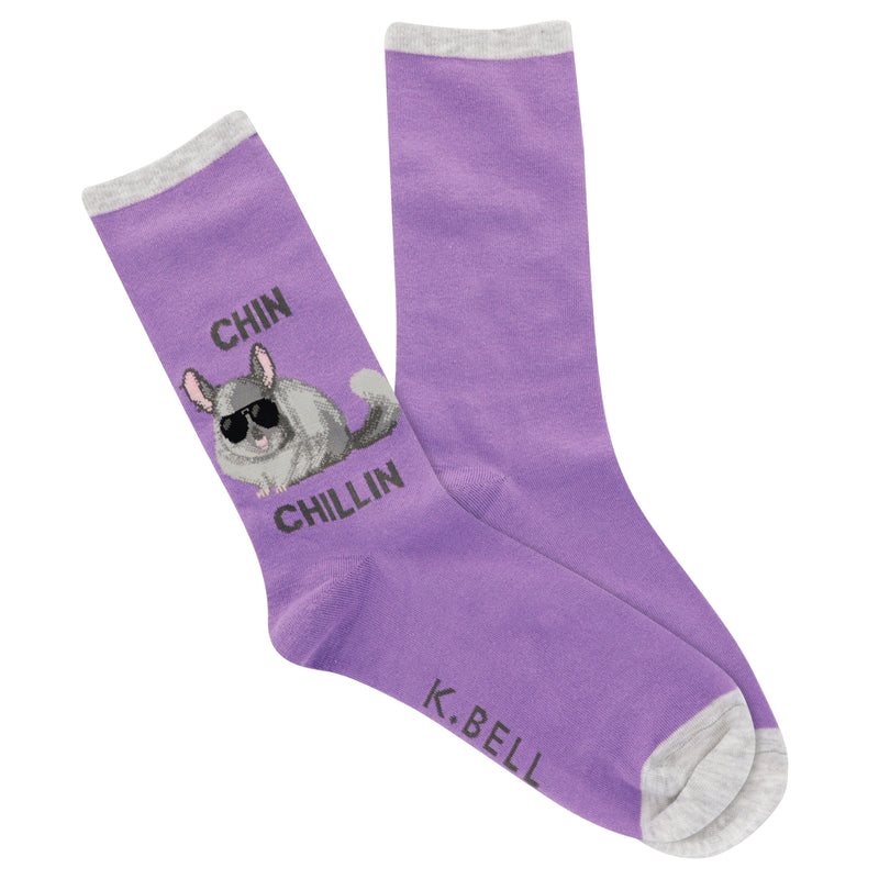 K Bell Womens Chin Chillin Sock starts on a background of Orchid. With Cuffs and Toes of  Light Heather Grey. On the Outside Ankle you see a Chinchilla in Light, Medium and Dark Grey wearing Black Glass  She has Pink Ears, Tongue and Nails. The Words say, "CHIN CHILLIN"