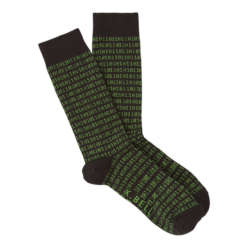 K Bell Mens Binary Tech Sock starts on a Black background. In a Bright Green glow begins a long series of Ones and Zeros. It starts right below the Cuff and forms around the Heel and stops at the Toes. It is a Sock to give the Binary Techs their Due. 