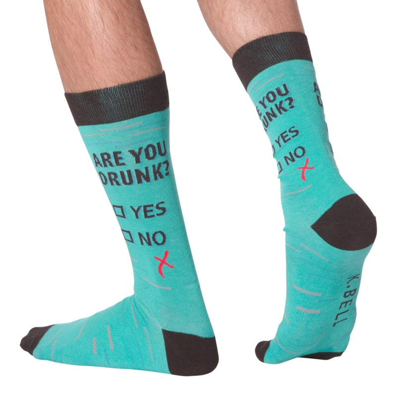Here is a Model Wearing The K Bell Are You Drunk Sock? This shows the Side and back view of the sock. .