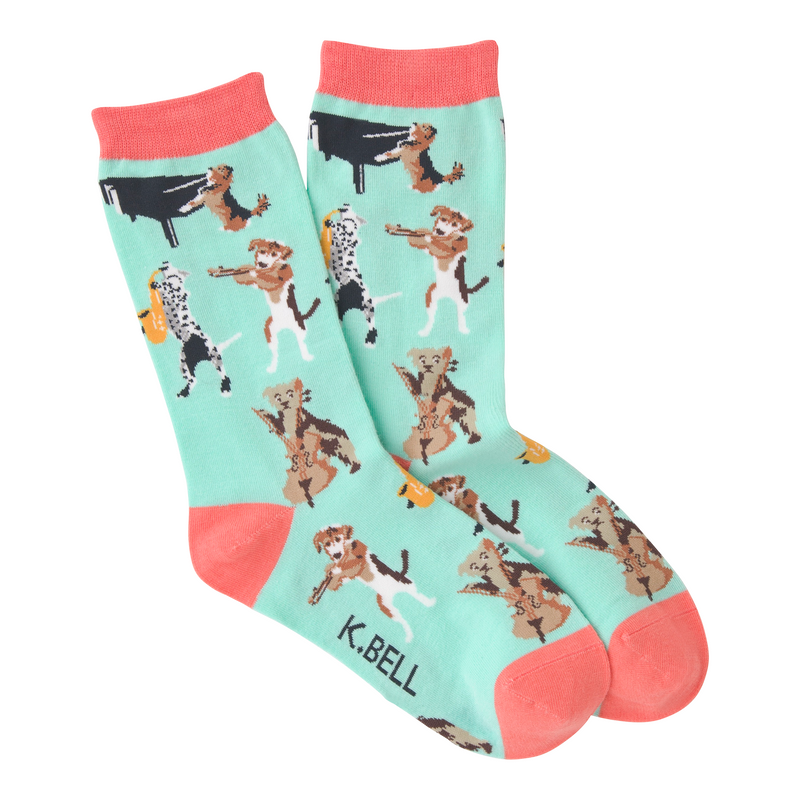 K Bell Musical Dogs Sock starts on a Teal background with Hot Coral Cuffs, Heels and Toes. In the Sock you will find several Dogs playing Instruments. A Piano, A Sax, A Violin and a Cello.  You never know they may end up playing with the neighbors!