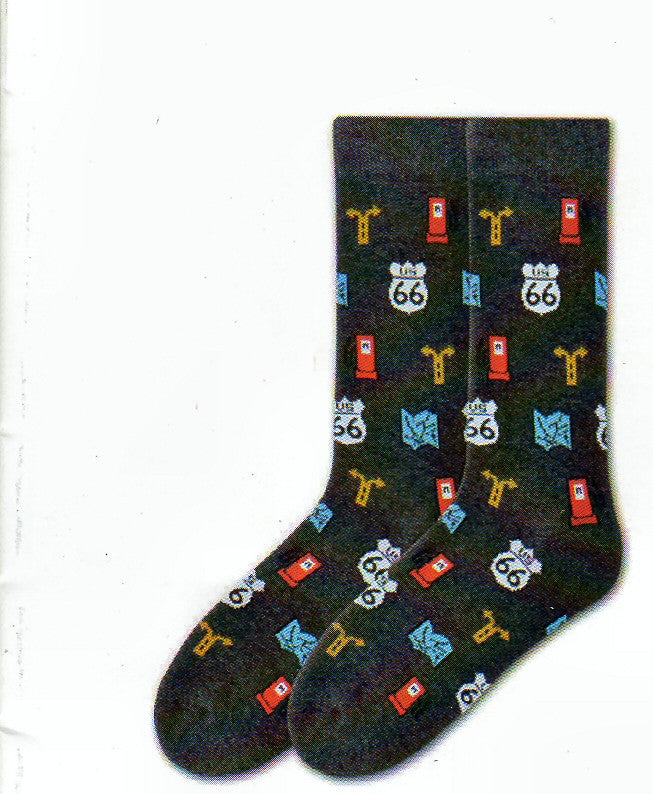 K Bell American Made Mens Route 66 Sock starts off with a Black Heather background. Then has Graphics of Route 66 US Sign in White and Black, Red Gas Pump, Blue Map to help you drive and a Yellow Road Sign for a Left or Right Turn.