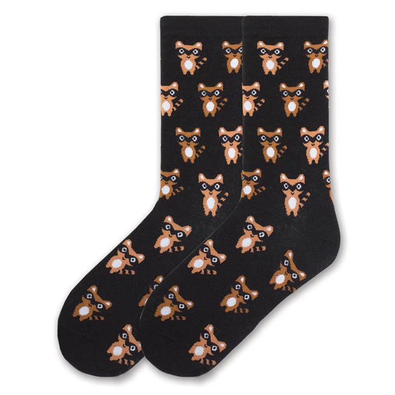 K Bell Ninja Raccoons Sock starts on a Black background. The Ninja Raccoons are on variegated rows. They are cute Ninjas with Masks of Black and White Eyes. The Raccoons are Brown and Black with White for added details.
