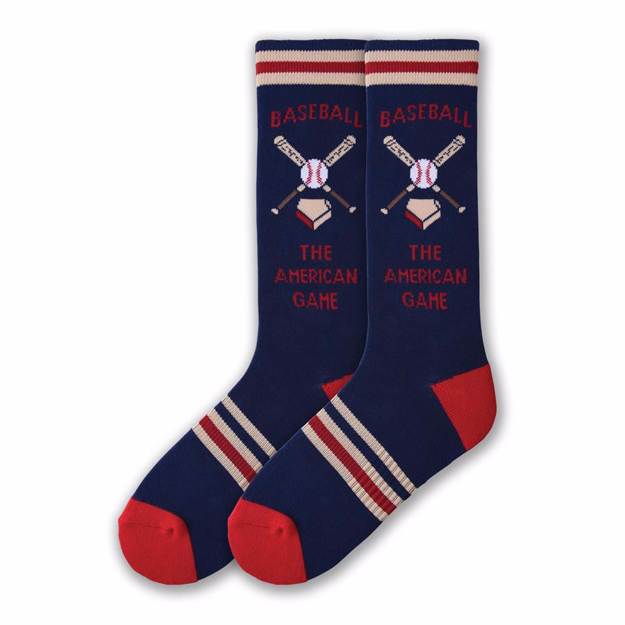 On a Navy Blue background with Red Heels and Toes starts K Bell American Made Mens American Game Sock. The Cuff has Red, White and Blue Stripes. Below are two Bats crossed with a Ball and Base. 