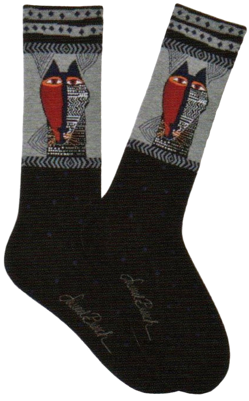 Laurel Burch Mens Native Cat Sock is Black with Dots at the foot and the Welt is the Cat face looking like a Native Mask. One Side all Red the other side is Black with symbols.