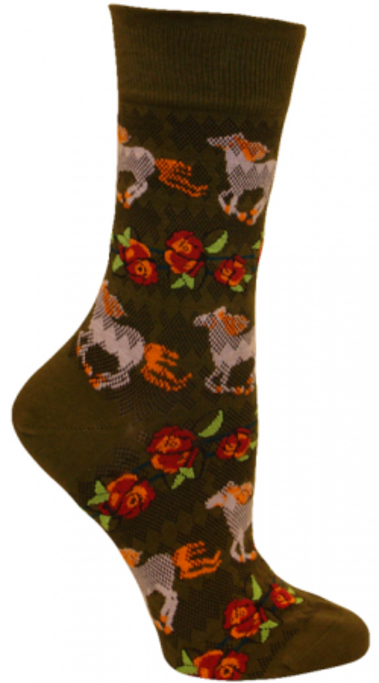 Ozone Horse Stripes Sock Khaki background starts with a Ruffle Top. The Picket Fence is a Burnout. The Horses are White with Tangelo Manes, Tails and Hooves. The next Stripe is a row of Roses. The Roses are Magenta and Tangelo with Teal lines and Pistachio Green leaves.
