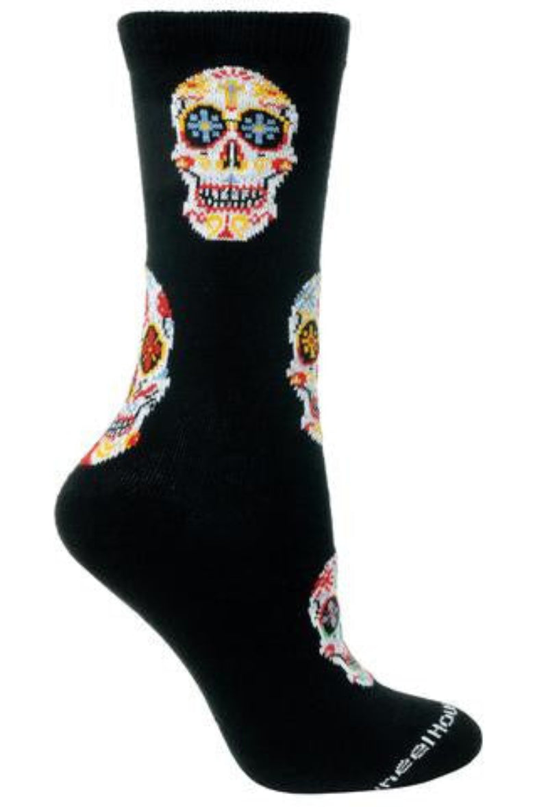 Wheel House Design Day of the Dead Sock starts on Black background with Ivory White Sugar Skulls all around. They are in different styles and colors