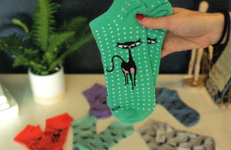 This Picture shows a close up of the Turquoise Cat Pin Dot which are White all over the Sock with the Complete Black Cat. It has a Pink Nose and Belly.