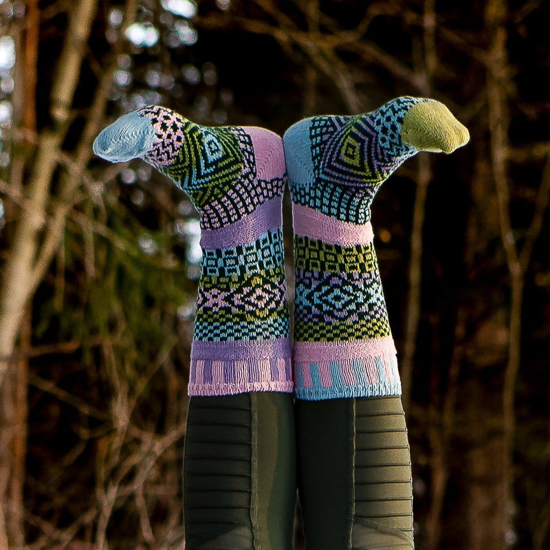 Solmate Adult Crew Lilac Sock is shown here upside down and in bright sunlight.