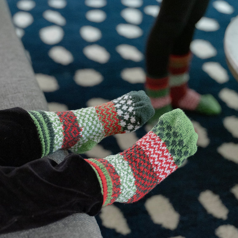 Solmate Baby Jolly Socks mismatched shown on a Model.