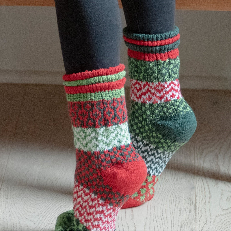 Solmate Kids Jolly Crew on Model showing the Mismatch fun of Christmas Season Colors