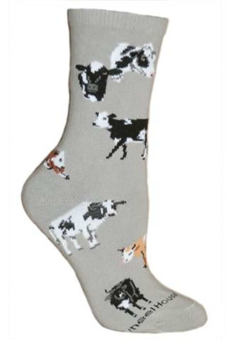 Wheel House Designs Cows All Over starts with a Grey background. At the top are Two Black and White Cows, their Heads only. Below are different breeds of Cows. Holstein, Hereford, Guernsey and Red Angus is a possibility. Both in Cows and Calves.