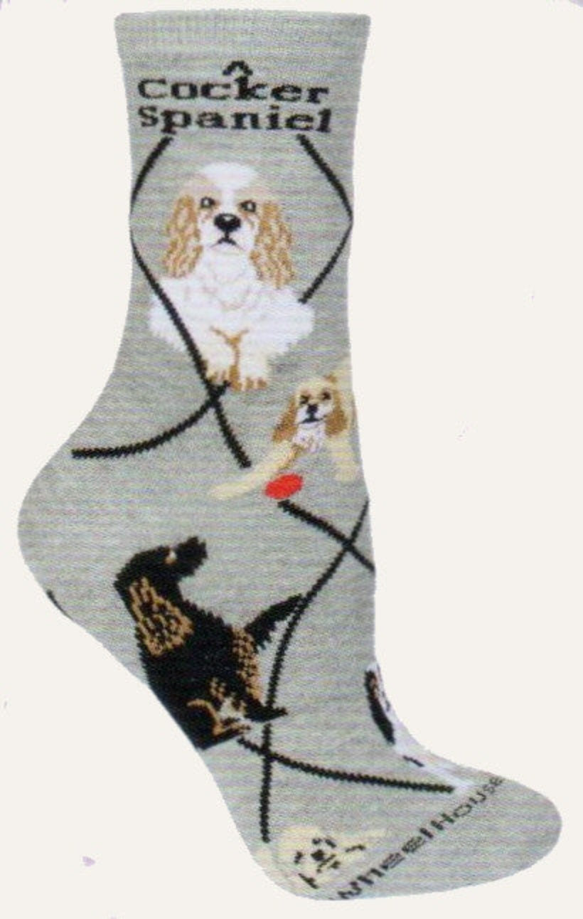 Wheel House Designs 3 Cocker Spaniels starts on a Grey background with Black Diamond Lines. There are 2 Profiles of the dogs at the top along with the breed name Cocker Spaniel. This sock has the most known colors for Cocker Spaniels represented on this sock in Poses below.