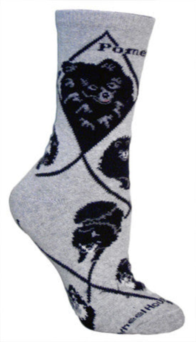 One Portrait shows the White Crest they can have the one showing is Black with Grey for detail. Pomeranian is written in Bold Black below the Cuff. The poses show the dog sitting standing and playing.