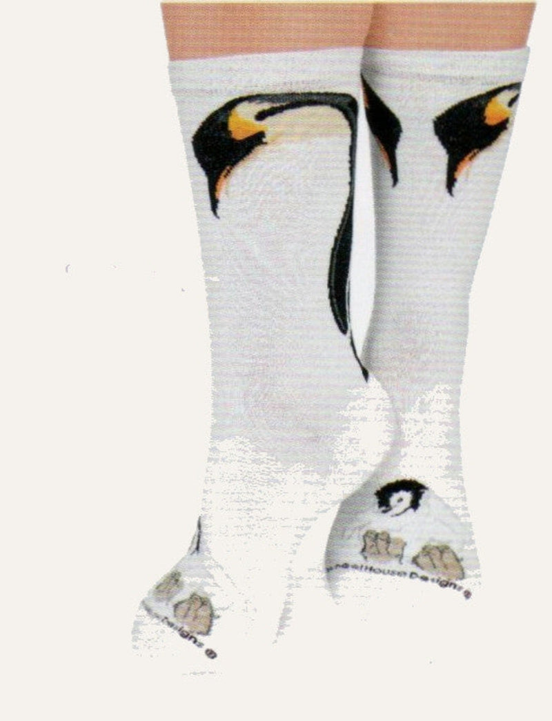 Wheel House Designs Penguin and Chick starts on Natural background with the Emperor Penguin Adult looking down at the chick on its feet.