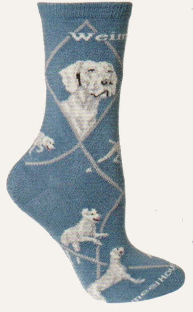 This Weimaraner Sock starts on Blue background with Light Grey Lines making the Diamonds and Medium Grey spelling out Weimaraner. The Portraits are Grey, Light and Medium, Black and White. The Poses are a Stance a Point for Hunting Laying down and Running.