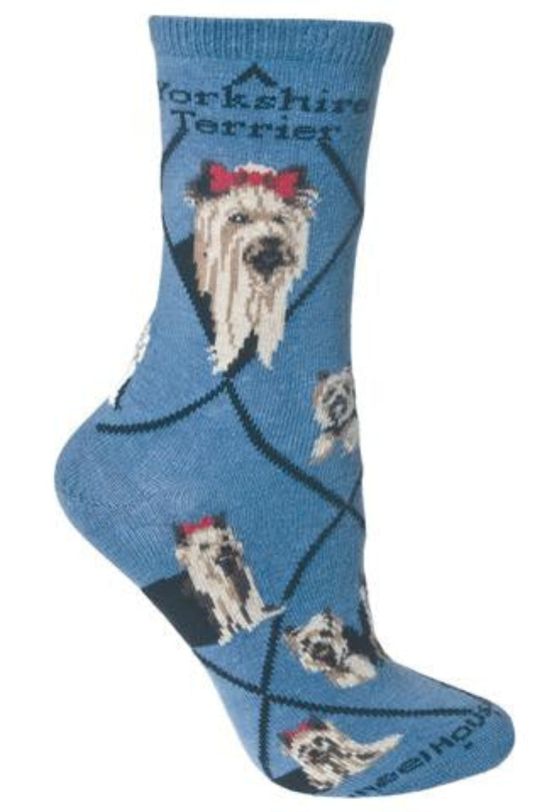 Wheel House Designs Yorkshire Terrier on Blue Sock starts with the Black Lines making Diamonds. On both sides of the sock reads, Yorkshire Terrier. The Portraits are both Frontal Views one of a Show Dog and One of a Home Body Dog. They are both Black and Tan. Also a unique feature on this sock is the new addition of the Biewer Yorkshire Terrier that is White Black and Tan in the Poses. Poses are of both Show Dog Yorkies and Yorkies that are home companions.