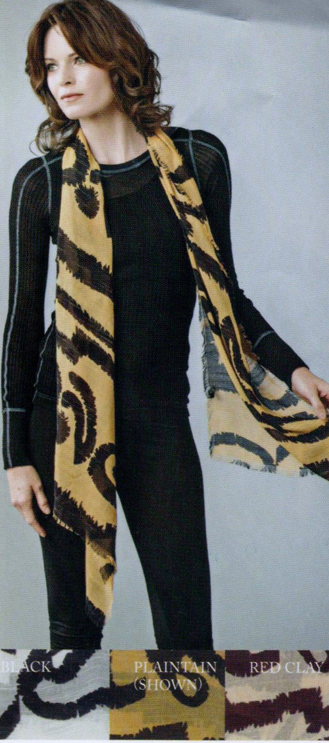 Zazou Serengeti Scarf in Plantain is being shown by the Model 