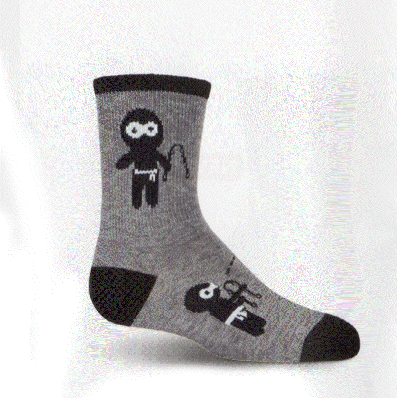 K Bell Kids Ninja Socks are started with a Charcoal Heather background. The Cuffs, Heels and Toes are Black. Below the Cuff on both sides is the Main Ninja with Nunchucks. On top of the foot are two Ninjas one with a sword the other with Nunchucks.