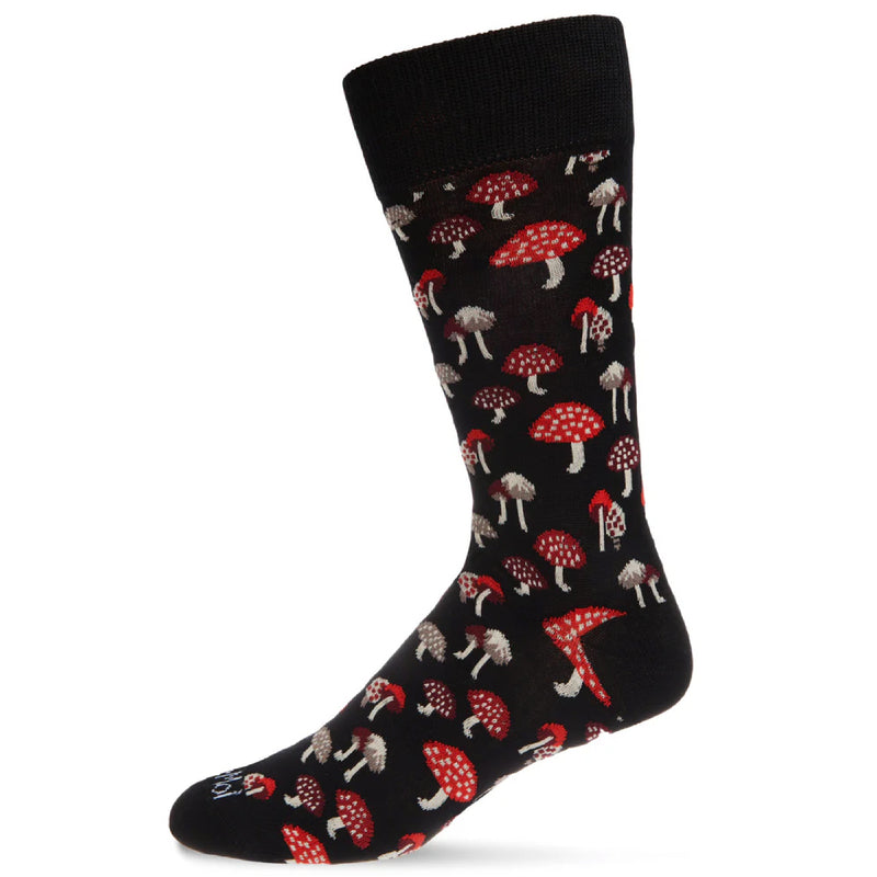 Black sock with red and white mushroom pattern on a white background