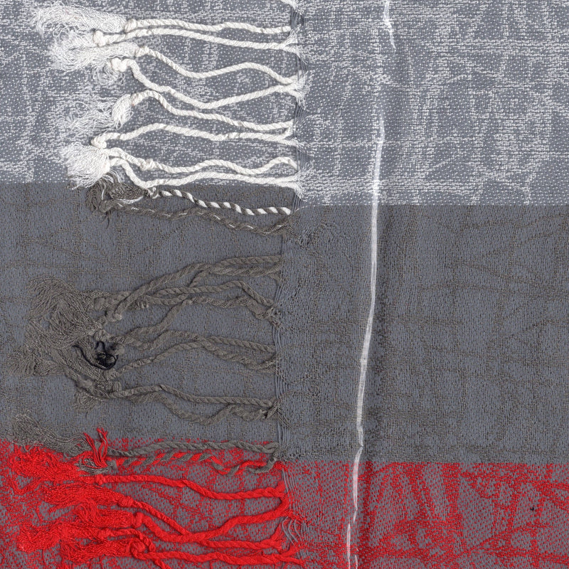Textured scarf fabric with red, gray, and white patterns