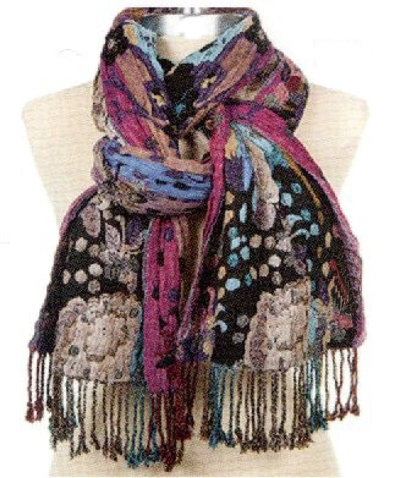 A multicolor patterned scarf with fringe, draped on a beige mannequin torso against a white background.