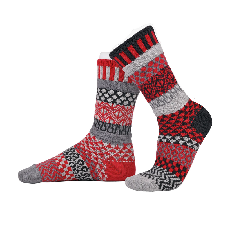 Pair of red, gray, and black patterned socks on a white background