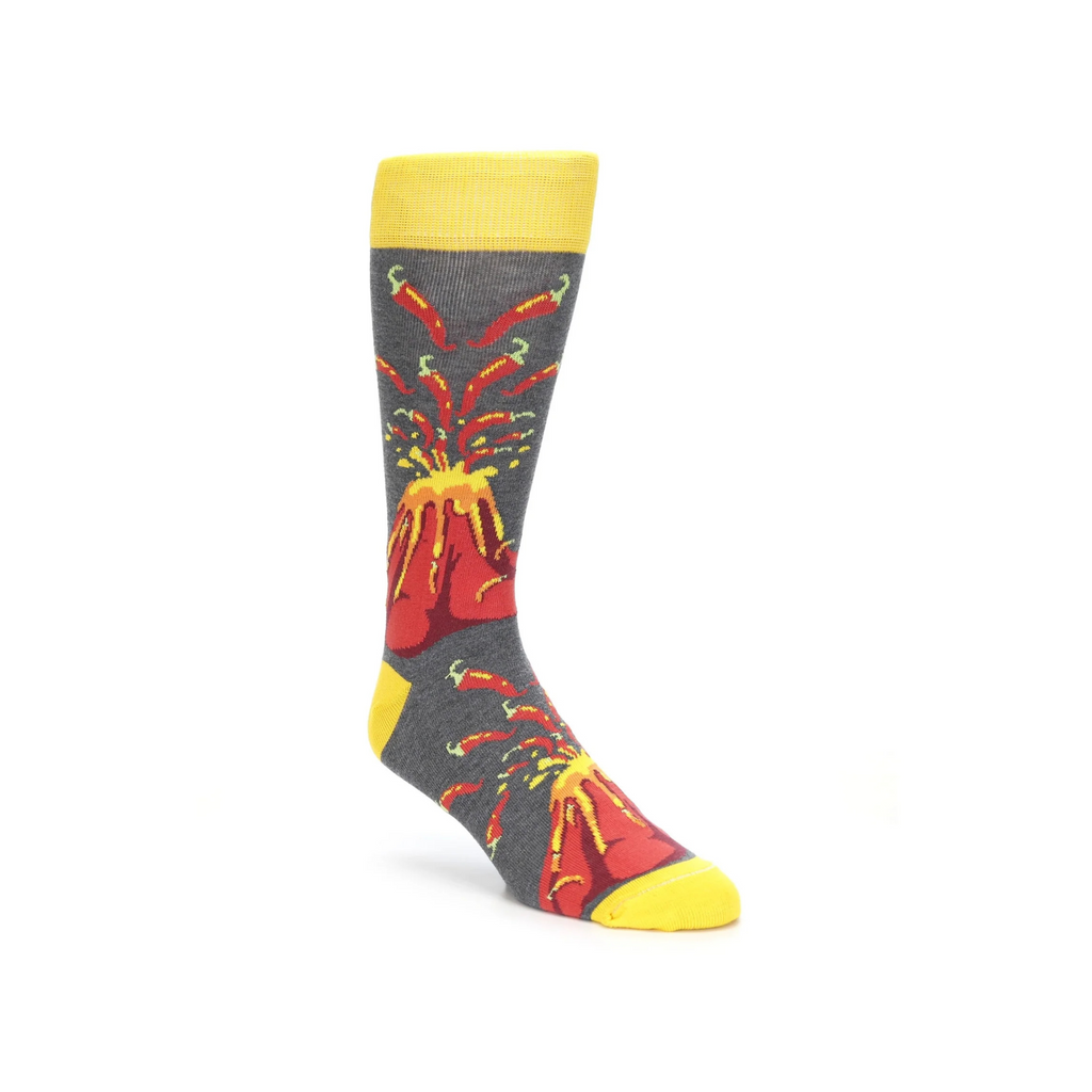 boldSOCKS Volcano Spice Socks starts on a Grey and Yellow background. Lava comes out of the Volcano, some is Volcano Peppers. Explosion above are Volcano Peppers.