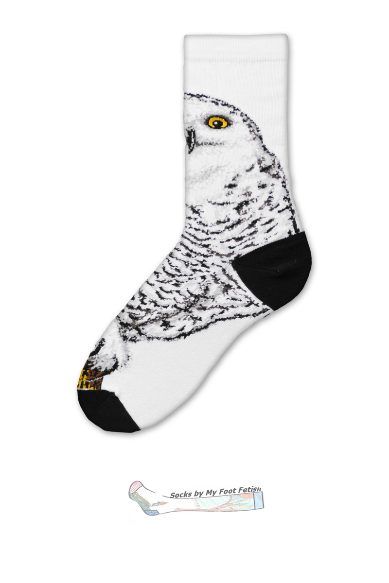 A single white crew sock featuring a detailed black and white sketch of a snowy owl with a yellow eye, finished with black toe and heel sections. A small brand logo for 'Socks by My Foot Fetish' is visible at the bottom.