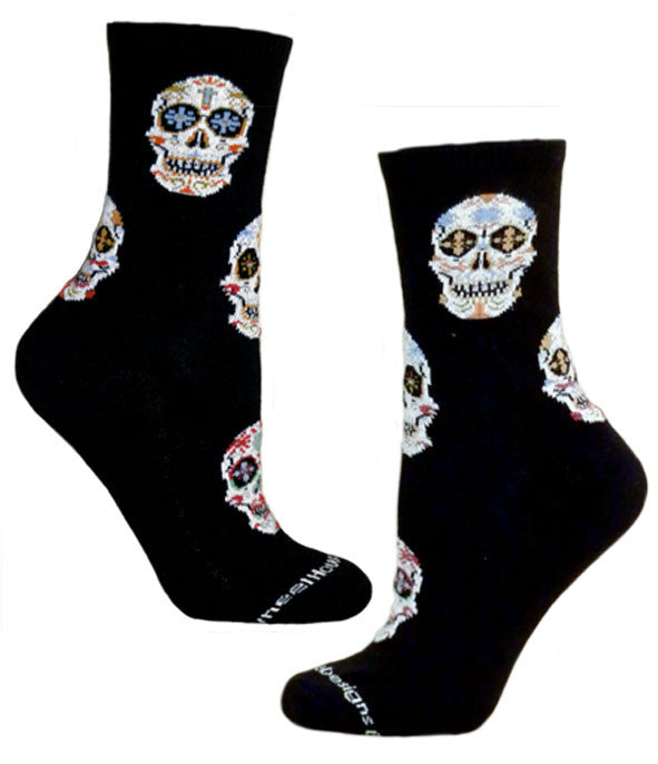 This shows the Day of the Dead Socks by Wheel House Design on Both Feet. Sugar Skulls in all the colors of the Rainbow.