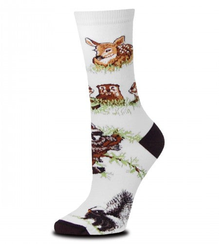 Woodland Creatures has a White background and Black Toes and Heels. Around the Sock are a Fawn, a family of Squirrels, a Raccoon, a Skunk and a Baby Black Bear.