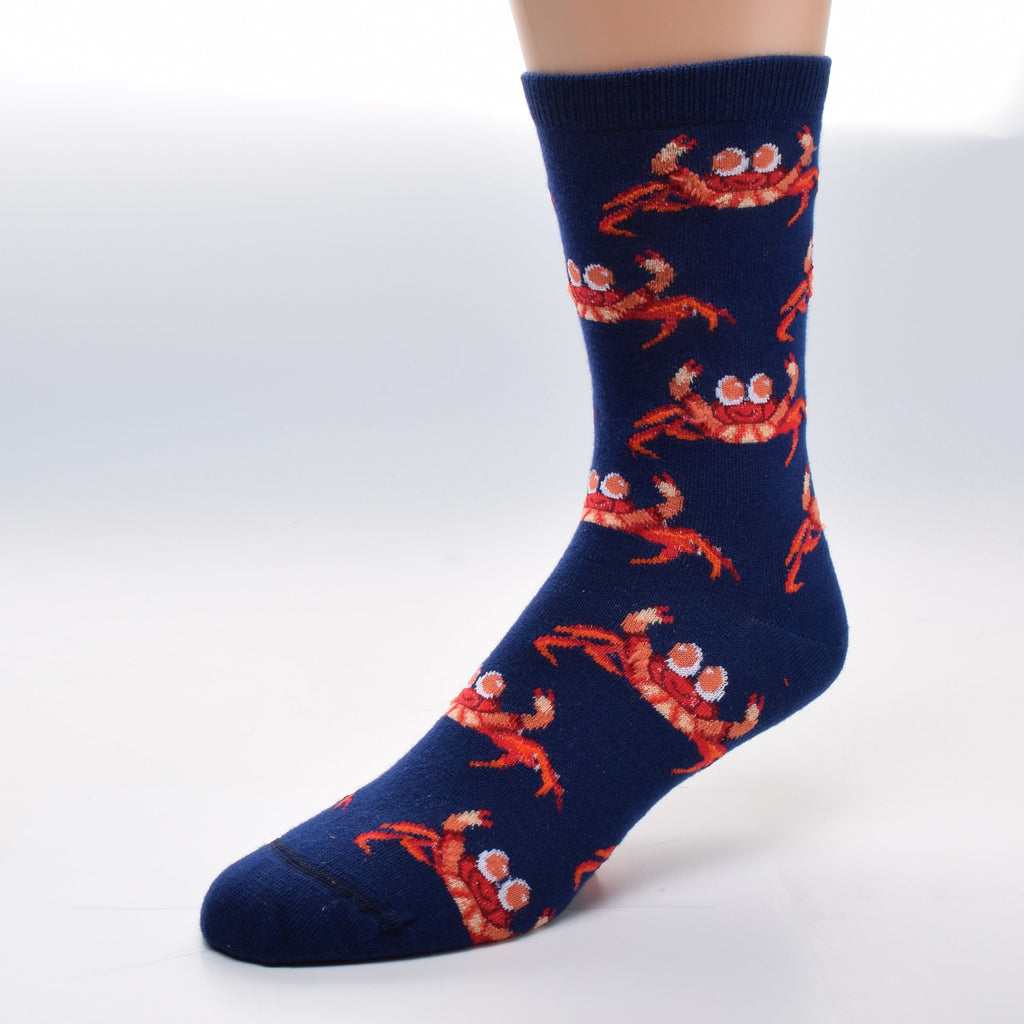 For Bare Feet Crab Jumbo Eyes Sock starts on a background of Navy. The Crabs are all in variegated rows over the Sock. They have Jumbo Eyes that are Coral and White. Happy Faces are Scarlet. The bodies are Buff, Coral and lined in Scarlet and Coquelicot. The Crabs Walking Legs are Coquelicot and Scarlet. The Claws are mostly Coral and Buff with Scarlet as the Pincers