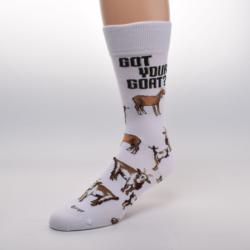 For Bare Feet Got Your Goat Sock starts on a Bright White background. In Bold Black print reads, "Got Your Goat?".  There are Goats and Kids all over the Sock. Colors are Browns, Rust, Russet, Camel and more with White and Black.