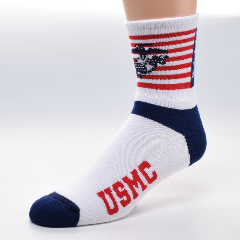For Bare Feet US Marines Flag Cuff Sock starts with the American Flag. 13 Red and White Stripes and a Canton of Navy Blue with White 5 point Stars. Superimposed is the US Marine Emblem. A Fouled Anchor like the Navy, with a Western Hemisphere Map and a Bald Eagle. A scroll in the Eagle's Mouth. Heels and Toes are Navy Blue. The rest of the foot is Bright White with Bold Red Letters reading, "USMC".