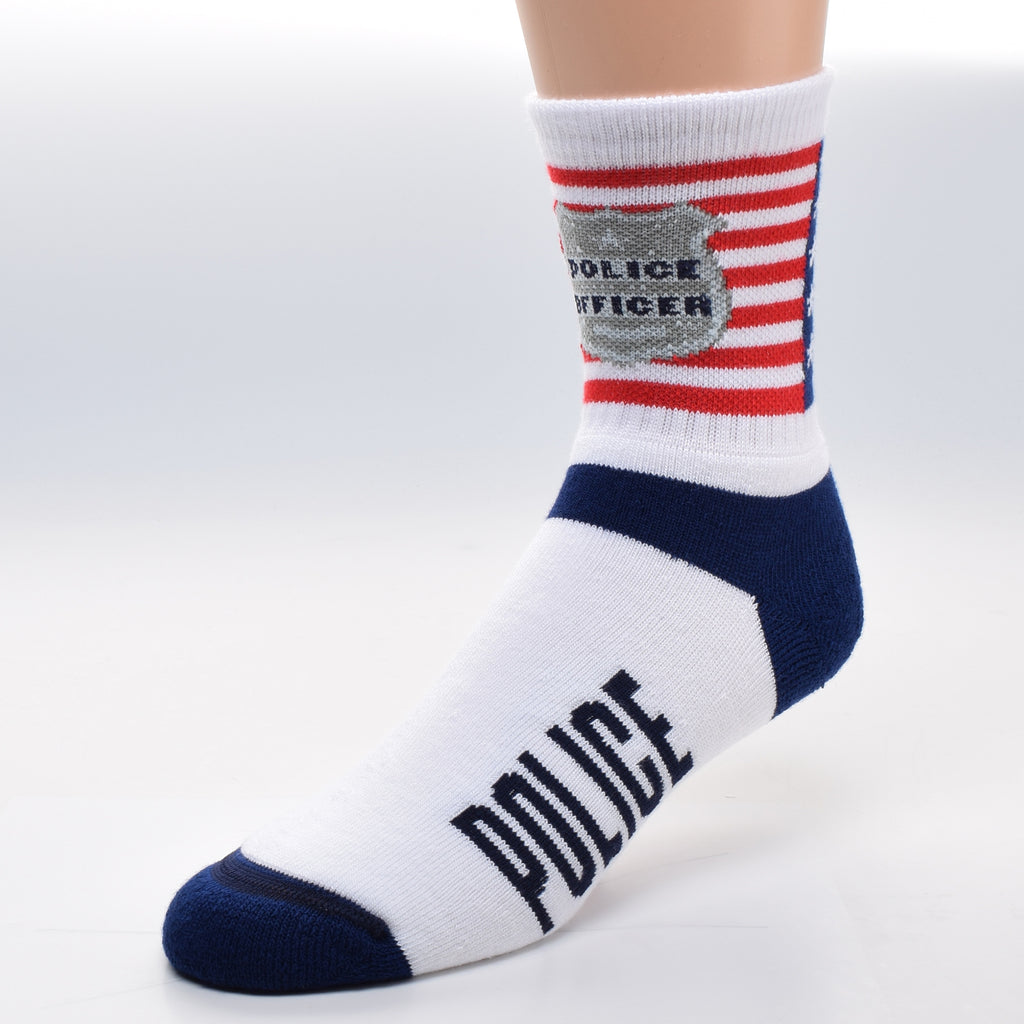 FBF Police Flag Cuff Sock starts with an American Flag on the Cuff with a Police Badge made in Cadet Grey and Cambridge Blue with Police Officer in Navy Blue Superimposed on the Flag. The Heels and Toes are Navy Blue and in a Field of White of the Foot reads on both sides Police.