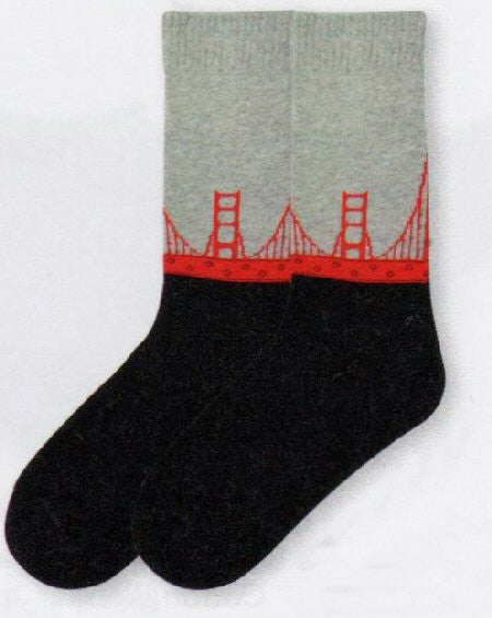 K Bell American Made Golden Gate Bridge Sock starts with Grey for Fog. The the Golden Gate Bridge spans across the Sock in Red. Then comes solid Black like the San Francisco Bay at Night.