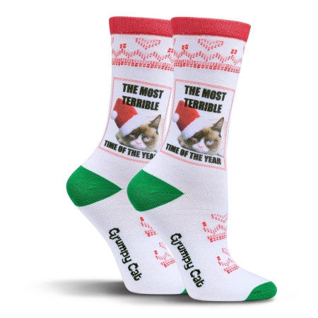 Grumpy Cat is wearing a Red and White Santa Hat and says, "It is the Most Terrible Time of the Year". Well maybe it is for him This Sock has all the standard Christmas Green and Red colors for fun.