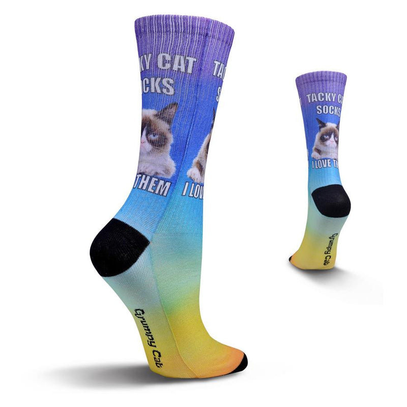 Grumpy Cat Womens Tacky Cat Sock begins with Black Toes and Heels. Then the Colors of the Rainbow start from the Toes going up the sock to the Cuffs. In the middle of the Ankle is Grumpy Cat and the Words above and below him read, "Tacky Cat Socks I Love Them"