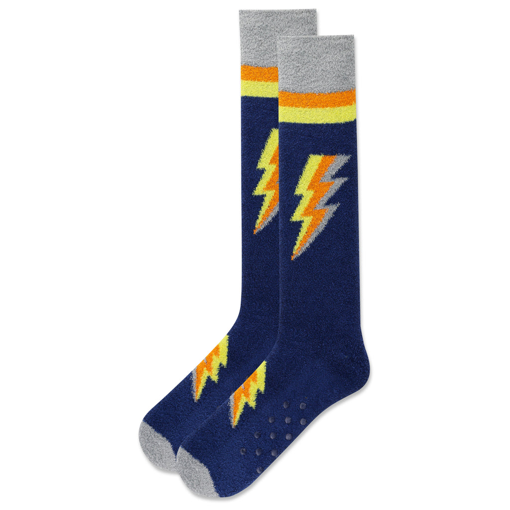 Hot Sox Mens Lightning Bolt Slipper Sock is Navy background with Grey Cuffs and Toes. Mango Tango and Lemon Stripes. The Lightning Bolts are Grey, Mango Tango, and Lemon. On Top and Top of Foot. Rubber Clear Dots on Bottom.