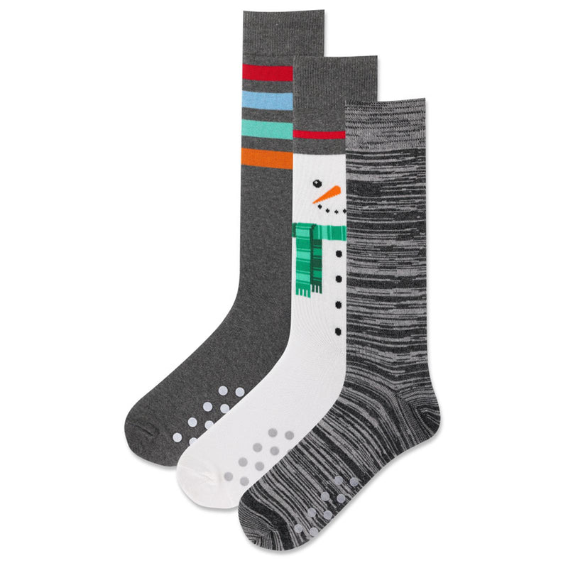 Hot Sox Mens Snowmen Cookie Box Non Skid Socks has 3 Socks in the Box. One Snowman, One Grey and Black variegated woven Sock and a Grey with Colored Stripes. All Non Skid are Grey Dots.