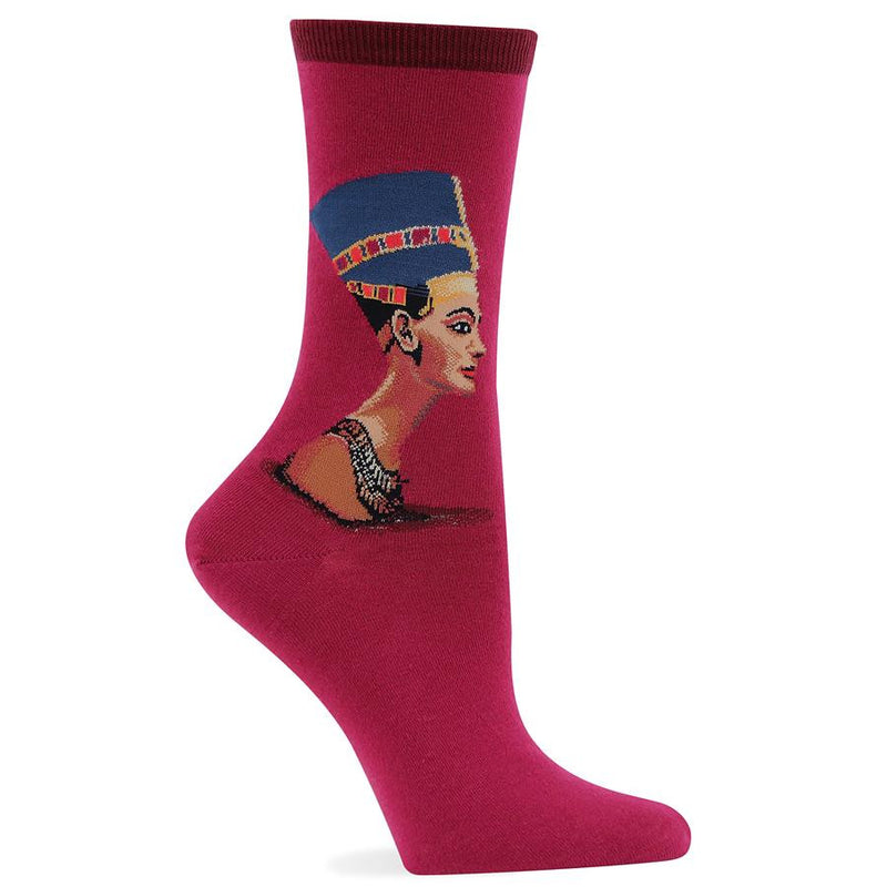 Hot Sox Nefertiti Sock begins with a Raspberry background. Her Bust begins below the Cuff in the center of the Leg before the Heel. Her Cap is Blue with Gold Red an Maroon inlays. Her face is a Profile with makeup detail. She wears a Necklace below her neck.